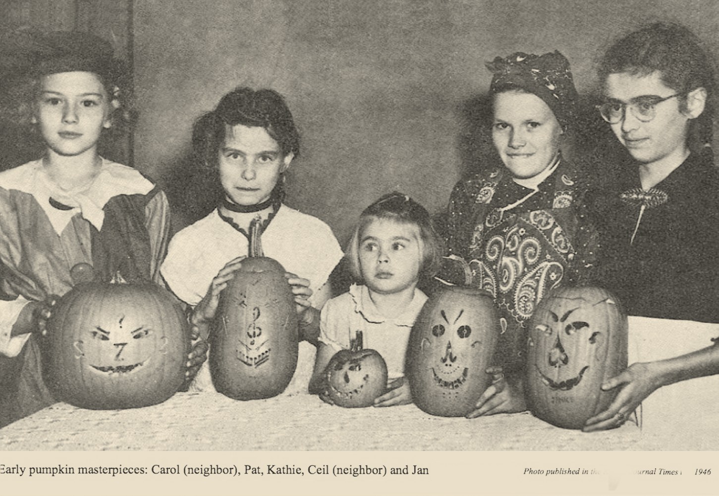 The Bardeen family daughters posing with their carved pumpkin masterpieces, circa 1946