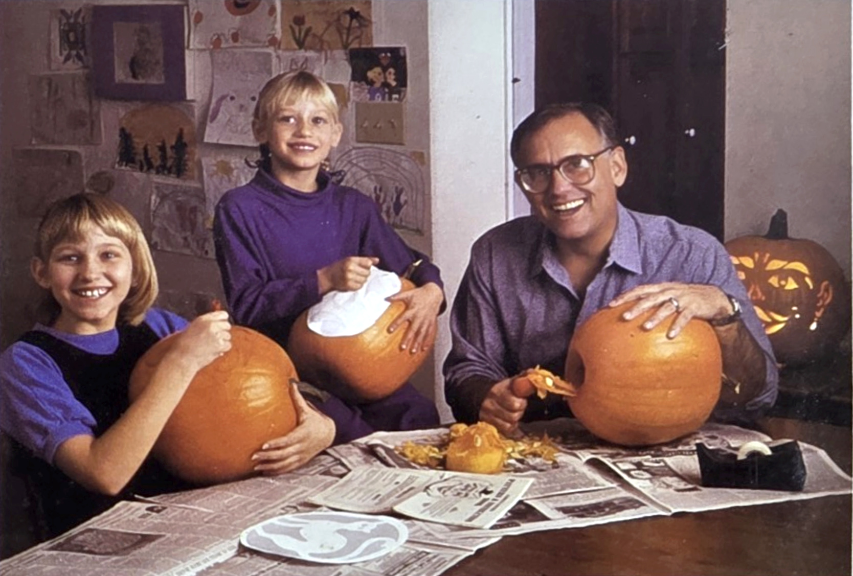 The Bardeen family carving pumpkins together, circa 1992